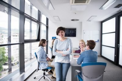 business women - app entrepreneur standing in front of table