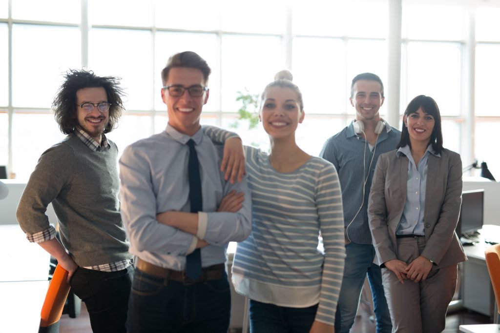 startup team smiling at app incubator