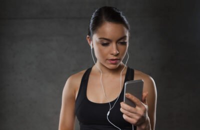 woman with smartphone using music app