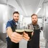 brewery owners holding beer glasses-brewery business plan