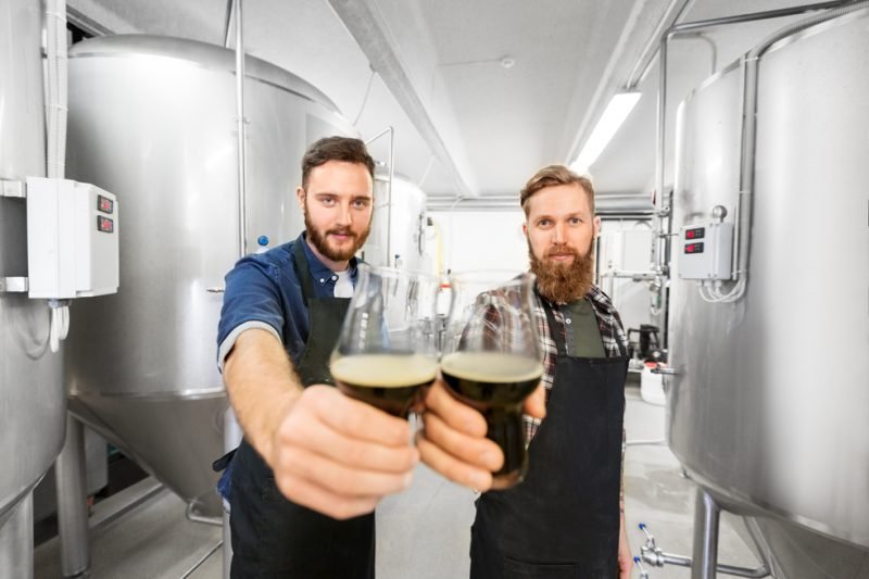 brewery owners holding beer glasses-brewery business plan