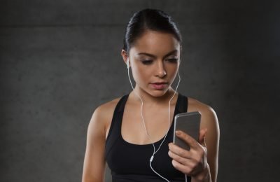 woman with smartphone using music app